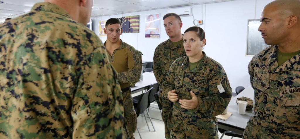 A group of Marines in a classroom at Typhoon Coast.